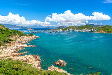 Nha Trang Bay summer days with sea light blue, cool, temperate climate, recognized most beautiful bays national scenic Vietnam, boats avoid storm far when rainy season comes.