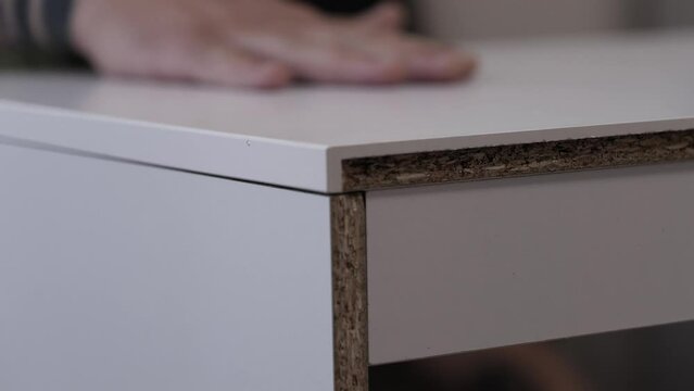 Fastening tabletops from chipboard to special fasteners. wood furniture assembly
