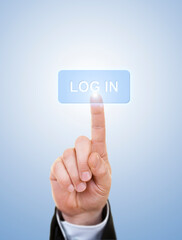 Businessman is Pushing On A Log in Button Against Blue