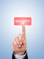 Businessman is Pushing On A Security Button Against Blue