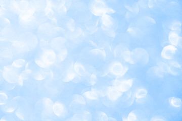 Beautiful light blue bokeh background. Abstract festive blurred background for your project with...