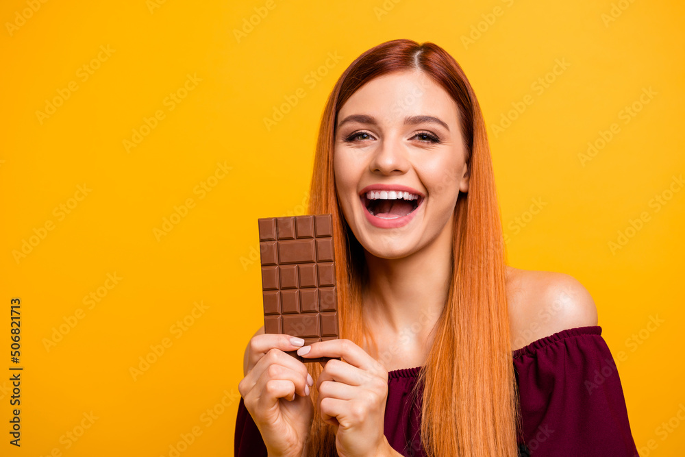 Sticker Photo of pretty cute young lady dressed red clothes ready eating milk chocolate empty space isolated yellow color background