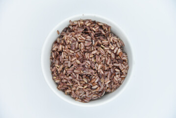 Brown Rice - Thai food, top view on white background.