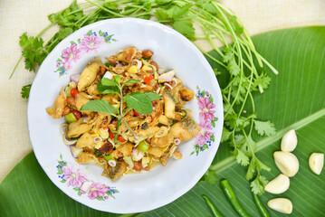 Spicy Crispy Snakehead Fish with Lemongrass  Salad - Thai food, top view on white background.