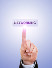 Businessman is Pushing On Networking Button Against Blue