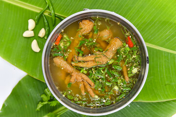 Chicken Feet Spicy Soup - Thai food, top view on white background.