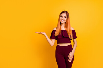 Photo of gorgeous positive person hand palm hold demonstrate empty space isolated on yellow color...
