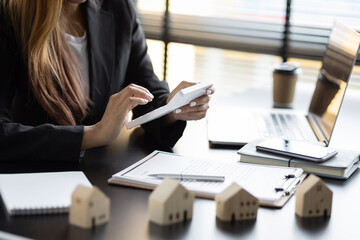 Home rental ideas, loans, mortgages and real estate valuations for sale. Businesswoman in a bank...
