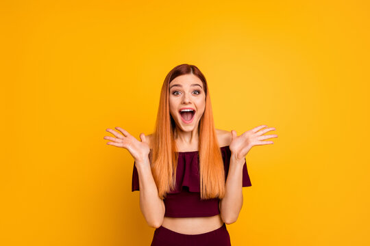 Portrait of funky astonished lady raise opened arms open mouth isolated on yellow color background