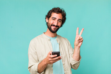 young adult hispanic crazy man using his phone