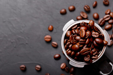 Hot fresh black coffee with milk foam for morning menu in white ceramic cup with coffee beans roasted on.