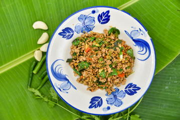 Minced Pork with Thai Basil - Thai food, top view on white background.