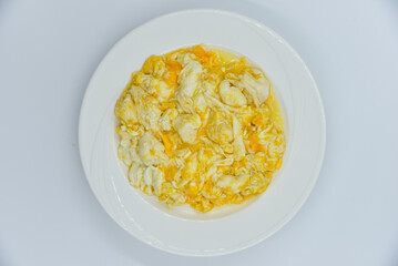 Crab Soft Omelet - Thai food, top view on white background.