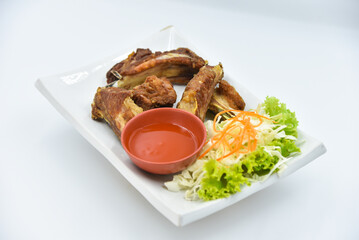 Deep-fried Pork Spare Rib - Thai food, top view on white background.