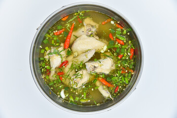 Mixed Chicken Wings Spicy Soup - Thai food, top view on white background.