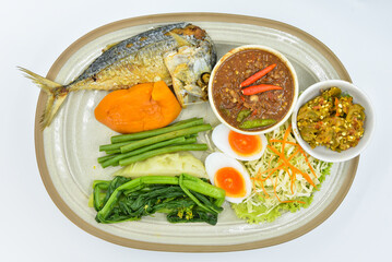 Nam Prik Set (Fried Mackeral Fish,Fermented Fish Spicy Dip,Spicy Shrimp-Paste Sauce) - Thai food, top view on white background.