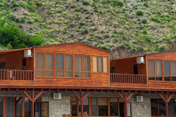 small hotel of several cottages in a mountain valley