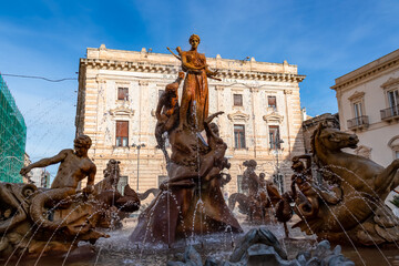 Close up view of historic baroque Fountain of Artemis on the Piazza Archimede in Ortigia, Syracuse (Siracusa), Sicily, Italy, Europe, EU. Diana fountain (Fontana di Diana). Detailed sculptures