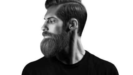 Black and white portrait of young bearded man standing against white background. Side view portrait of thinking stylish young man looking away. Perfect beard.