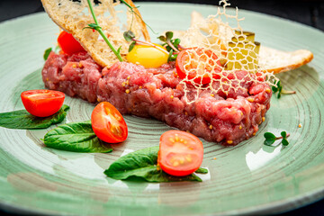 Beef steak tartare with raw egg yolk