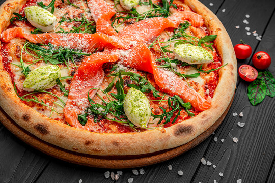 Pizza with salmon and cream cheese.