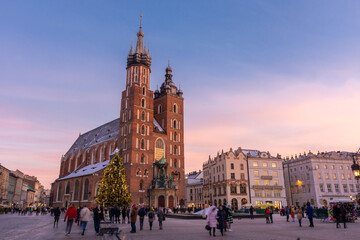 Fototapeta na wymiar Sunset over the St. Mary's Basilica in Rynek Glowny square, Krakow, Poland