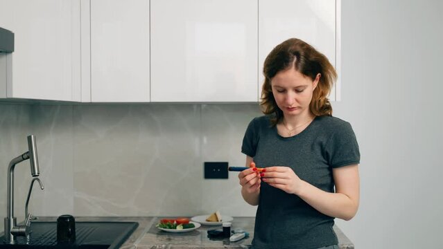 Woman diabetic giving insulin injection into shoulder using insulin pen at home. Treatment and controlling diabetes, healthcare. Manual injection of insulin. Pancreas does not produce hormone