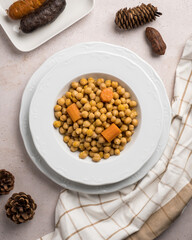Cooked chickpeas with carrot, blood sausage and chorizo
