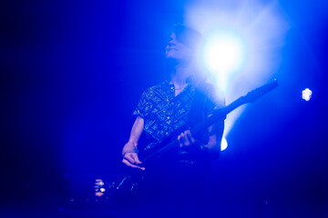 Close-up of guitarist in concert