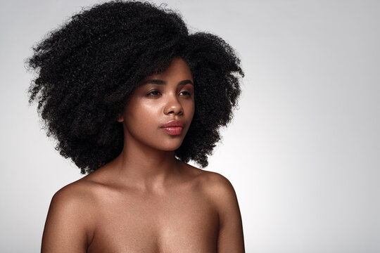 Black model with clean skin looking away