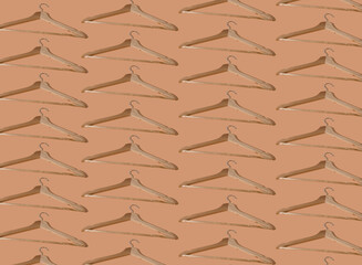 Pattern hangers for clothes. Hanger set. Beige background copy space banner. Wooden hangers. Store shop. Pastel color. Sale concept.