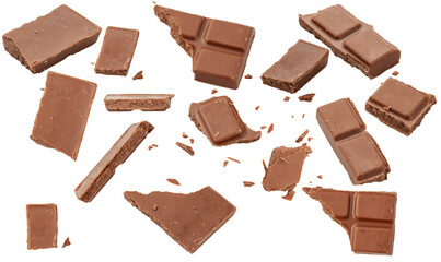 Milk chocolate broken into pieces. Chocolate bar, crumb, shavings. Chocolate slices isolated on white background.