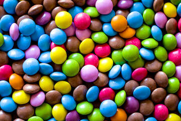 Fototapeta na wymiar Selective focus. Small colorful candies. Colorful chocolate dragee.