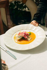 Sea bass steak in yellow stew in Venice