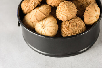 Tasty butter cookies in a tin on gray background Set of crispy shortbread biscuits in an open container Baked pastry, breakfast sweet food Above