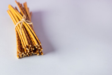 Bread sticks or Salted crackers on Blue background Copy space Above