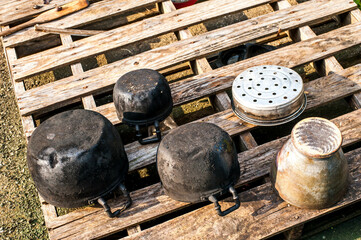 Old vintage fire pots and mortar on wood in Nongbualamphu province ,Thailand