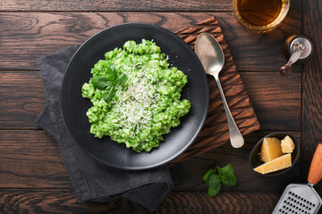 Italian risotto. Delicious risotto with pesto sauce or wild garlic pesto, basil, parmesan cheese...