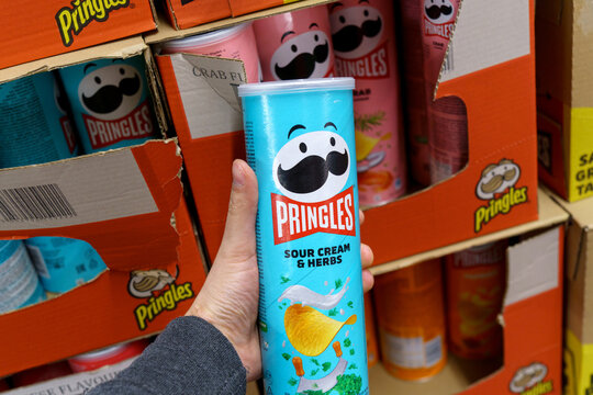 Tyumen, Russia-May 08, 2022: Pringles sour cream products with a new logo in the grocery supermarket. Pringles is a brand of potato chips for snacks