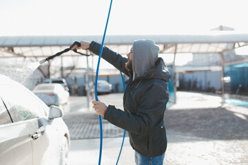 Washing car on a self-service car wash.