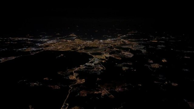 Aerial view of Madrid city, Spain, at night, from a jet cockpit al 10000 m