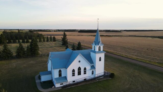 An ancient christian church viewed from above at sunset in north America. Wide angle aerial orbit