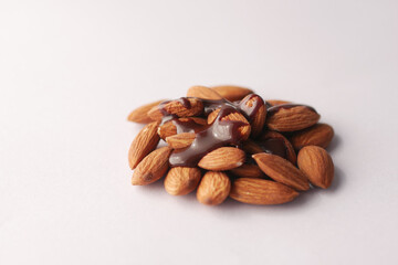 almond nut and chocolate liquid on white background 