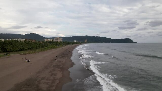 Beach sunset filming at low altitude, Aerial drone images, Beach Jaco, Puntarenas, Costa Rica,