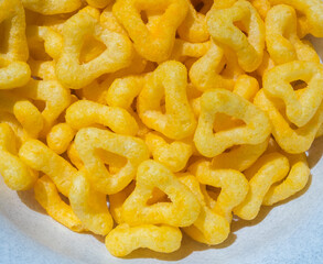 
snacks and chips on a white plate close-up