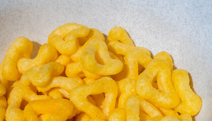 
snacks and chips on a white plate close-up