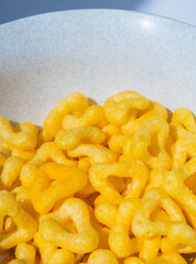 
snacks and chips on a white plate close-up