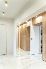 Photo of interior details of spacious modern corridor in apartment.