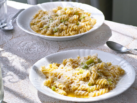 Carbonara pasta frutilli with green sparagus and cheese Parmiggiano Reggiano.