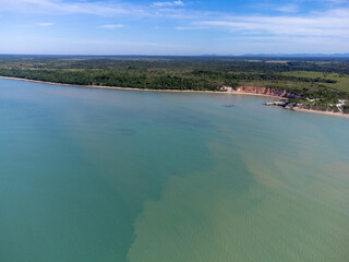 Amazing paradisiacal and deserted beach with clear blue waters and visible corals at low tide - Cumuruxatiba, Bahia, Brazil - aerial drone view